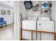 Laundry room with white washer and dryer, shelving, and storage space at 6309 Newtown Cir # 9B2, Tampa, FL 33615
