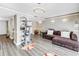 Spacious living room showcasing wood-look flooring and neutral paint colors at 6309 Newtown Cir # 9B2, Tampa, FL 33615