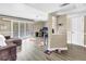 Open living space with wood flooring and sliding glass doors to balcony at 6309 Newtown Cir # 9B2, Tampa, FL 33615