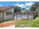 Gated community pool area with clean pool water, pool house, and serene landscaping at 6309 Newtown Cir # 9B2, Tampa, FL 33615