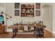 Eclectic bar area featuring a rustic workbench, wine rack, and unique artwork, perfect for entertaining at 6909 Crestpoint Dr, Apollo Beach, FL 33572