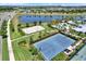Community amenities including a basketball court, sand volleyball court, pool, and grassy lounging area at 6909 Crestpoint Dr, Apollo Beach, FL 33572