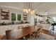 Dining space features a large table, stylish lighting, and a convenient coffee bar area adjacent to the kitchen at 6909 Crestpoint Dr, Apollo Beach, FL 33572