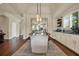 Spacious dining room with a large table, statement mirror, and coffee bar at 6909 Crestpoint Dr, Apollo Beach, FL 33572