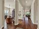 Spacious living room featuring hardwood floors, stylish columns, and an open floor plan at 6909 Crestpoint Dr, Apollo Beach, FL 33572