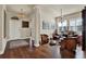 Open living room with hardwood floors, leather chairs, a decorative rug, and stylish lighting at 6909 Crestpoint Dr, Apollo Beach, FL 33572