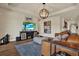 Stylish living area with a large television, comfortable seating, and modern decor at 6909 Crestpoint Dr, Apollo Beach, FL 33572