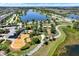 Aerial view of a community playground, walking paths, and picnic areas in a well-maintained green space at 6909 Crestpoint Dr, Apollo Beach, FL 33572