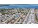 High-angle aerial view displays houses and community near the ocean with waterfront access at 7607 22Nd W Ave, Bradenton, FL 34209