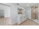 Well-lit renovated bathroom with marble countertop, modern fixtures, and a glass-walled shower at 7607 22Nd W Ave, Bradenton, FL 34209
