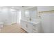 This renovated bathroom boasts double closets, a white marble countertop, and a modern design at 7607 22Nd W Ave, Bradenton, FL 34209