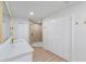 Bright bathroom features a marble countertop, wood floors and glass-walled shower at 7607 22Nd W Ave, Bradenton, FL 34209