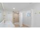 A bright, renovated bathroom showcasing a glass-walled shower and modern fixtures at 7607 22Nd W Ave, Bradenton, FL 34209