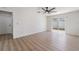 Bedroom with wood floors and sliding glass door to backyard at 7607 22Nd W Ave, Bradenton, FL 34209