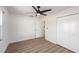 Bedroom with wood floors, ceiling fan, closet and access to ensuite bathroom at 7607 22Nd W Ave, Bradenton, FL 34209