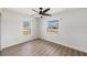 Bright bedroom with wood floors, ceiling fan, and large windows at 7607 22Nd W Ave, Bradenton, FL 34209