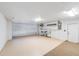 Bright garage featuring sealed concrete flooring, storage, and ample space at 7607 22Nd W Ave, Bradenton, FL 34209