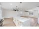 Spacious open-concept kitchen featuring a large island with quartz countertops and stylish gold hardware at 7607 22Nd W Ave, Bradenton, FL 34209