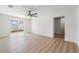 Living Room with wood floors and sliding glass door to backyard at 7607 22Nd W Ave, Bradenton, FL 34209