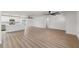 Open-concept living room with hardwood floors, recessed lighting, and access to the kitchen at 7607 22Nd W Ave, Bradenton, FL 34209