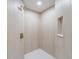 This modern tile shower features designer fixtures and a built-in niche at 7607 22Nd W Ave, Bradenton, FL 34209
