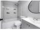 Bathroom features a bathtub and shower combination, and updated vanity with sink and faucet at 8039 Garden Dr # 105, Seminole, FL 33777
