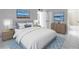 Serene bedroom featuring a comfortable bed, stylish furnishings, and soothing decor at 8039 Garden Dr # 105, Seminole, FL 33777