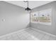Dining area with white tile flooring and bright natural lighting at 8039 Garden Dr # 105, Seminole, FL 33777