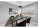 Chic dining room featuring a modern table, stylish chairs, and a decorative art piece at 8039 Garden Dr # 105, Seminole, FL 33777