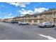 Exterior view of a two-story building with ample parking at 8039 Garden Dr # 105, Seminole, FL 33777
