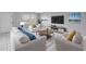 Inviting living room with plush seating, modern entertainment center and bright natural light at 8039 Garden Dr # 105, Seminole, FL 33777
