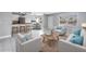 Bright living room featuring modern furniture, neutral tones and a cozy layout with a coffee bar and dining table at 8039 Garden Dr # 105, Seminole, FL 33777