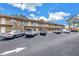 Exterior shot showing ample parking space available near the units, providing convenience for residents and guests at 8039 Garden Dr # 105, Seminole, FL 33777