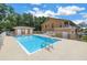 Community pool surrounded by ample deck space, offering a resort-like experience for residents at 8039 Garden Dr # 105, Seminole, FL 33777