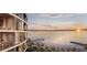 Panoramic beachfront view with ocean sunrise seen from luxury condo balconies at 805 S Gulfview Blvd # 304A, Clearwater, FL 33767