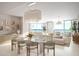 Open-concept living and dining area with modern furnishings and water views at 805 S Gulfview Blvd # 602A, Clearwater, FL 33767