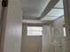 Bathroom with a shower-tub combination with a window letting in natural light at 8130 Shalom Dr, Spring Hill, FL 34606