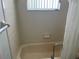 The bathroom features a clean bathtub and shower with neutral tile surround at 8130 Shalom Dr, Spring Hill, FL 34606