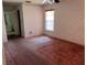 Bedroom featuring wallpaper, standard closet, and sliding glass window at 8130 Shalom Dr, Spring Hill, FL 34606