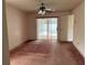 Bedroom features a ceiling fan, sliding glass door leading to the pool area at 8130 Shalom Dr, Spring Hill, FL 34606