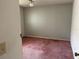 Light green bedroom featuring pink carpeting, a single window and neutral walls at 8130 Shalom Dr, Spring Hill, FL 34606
