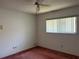 This bedroom features neutral walls, pink carpeting, a ceiling fan and natural light at 8130 Shalom Dr, Spring Hill, FL 34606