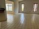 Bright bonus room featuring tile flooring and views of the lanai with three large windows at 8130 Shalom Dr, Spring Hill, FL 34606