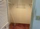 Walk-in closet with metal shelving and carpet flooring, needs work at 8130 Shalom Dr, Spring Hill, FL 34606