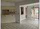 Spacious eat-in kitchen area with a breakfast bar and access to an outdoor patio at 8130 Shalom Dr, Spring Hill, FL 34606