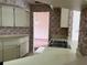Kitchen showcasing tile backsplash, countertop, sink, and view into the living room area at 8130 Shalom Dr, Spring Hill, FL 34606