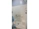 Bathroom shower with bench and modern fixtures and a blue accent stripe at 834 Tremont Greens Ln # 137, Sun City Center, FL 33573