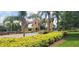 Community entrance gate featuring well-manicured landscaping and decorative architecture at 834 Tremont Greens Ln # 137, Sun City Center, FL 33573