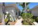 Charming villa featuring well-maintained landscaping and walkway to the front entrance at 834 Tremont Greens Ln # 137, Sun City Center, FL 33573