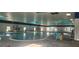 Spacious indoor pool area with ample lighting and comfortable seating at 834 Tremont Greens Ln # 137, Sun City Center, FL 33573